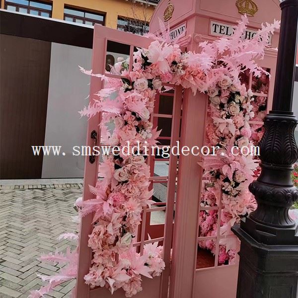 pink phone booth with flowers