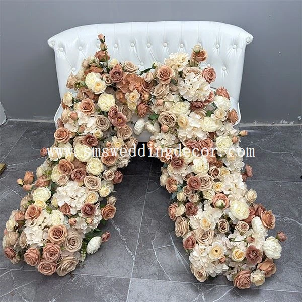 attaching flowers to wedding arch